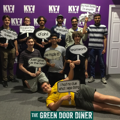 Arctic Wolf co-op students posing for a group photo after completing an escape room during a work social event.