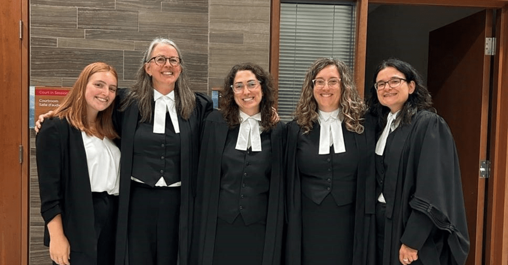 Lawyers posing for image in law regalia 