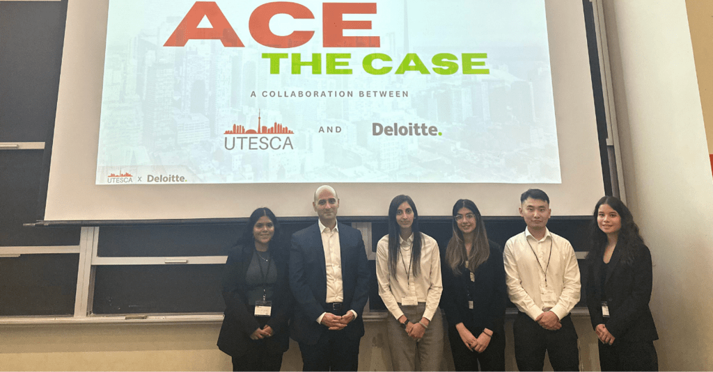 Group photo of co-op students and the Deloitte team at a presentation