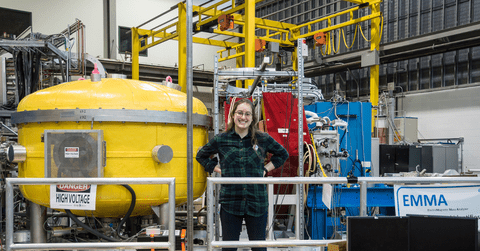 co-op student standing in an engineering lab at TRIUMF