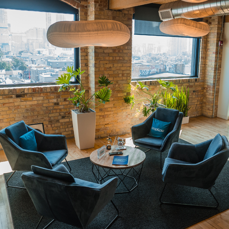 Open workspace at Loopio offices with big windows and relaxed seating