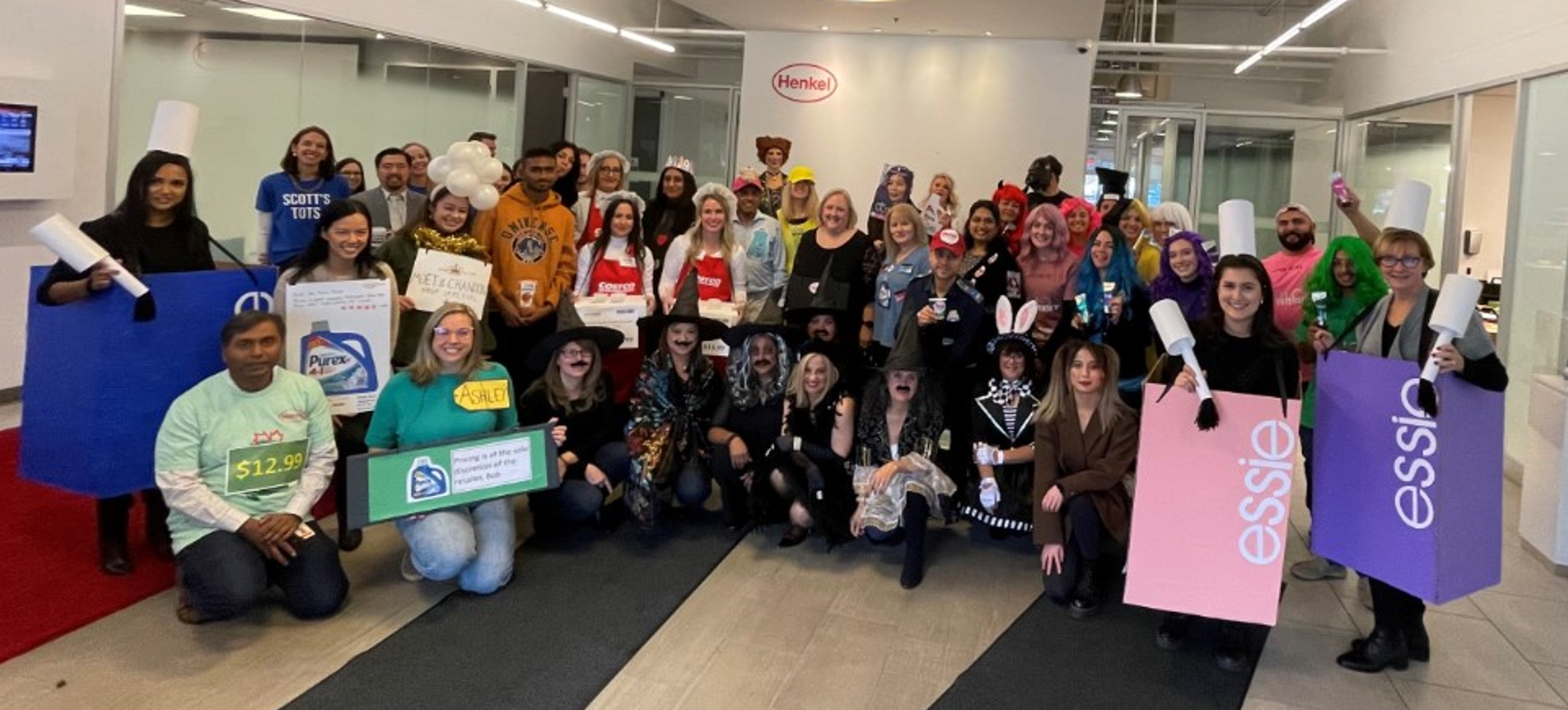 Large group of Henkel employees and co-op students dressed up in halloween costumes