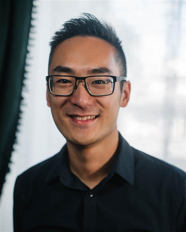 Profile Photo of Brian Mao wearing a black buttoned up shirt