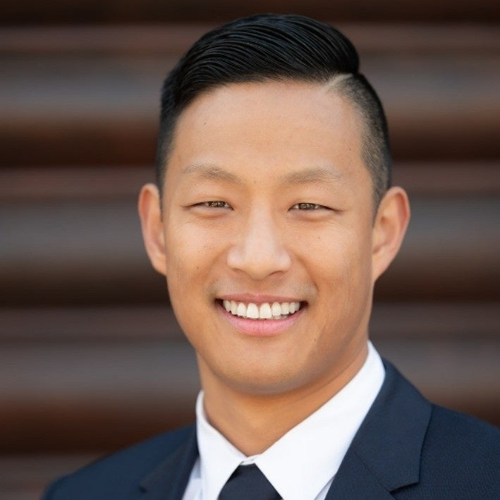 Profile photo of Edmund Tan wearing a suit