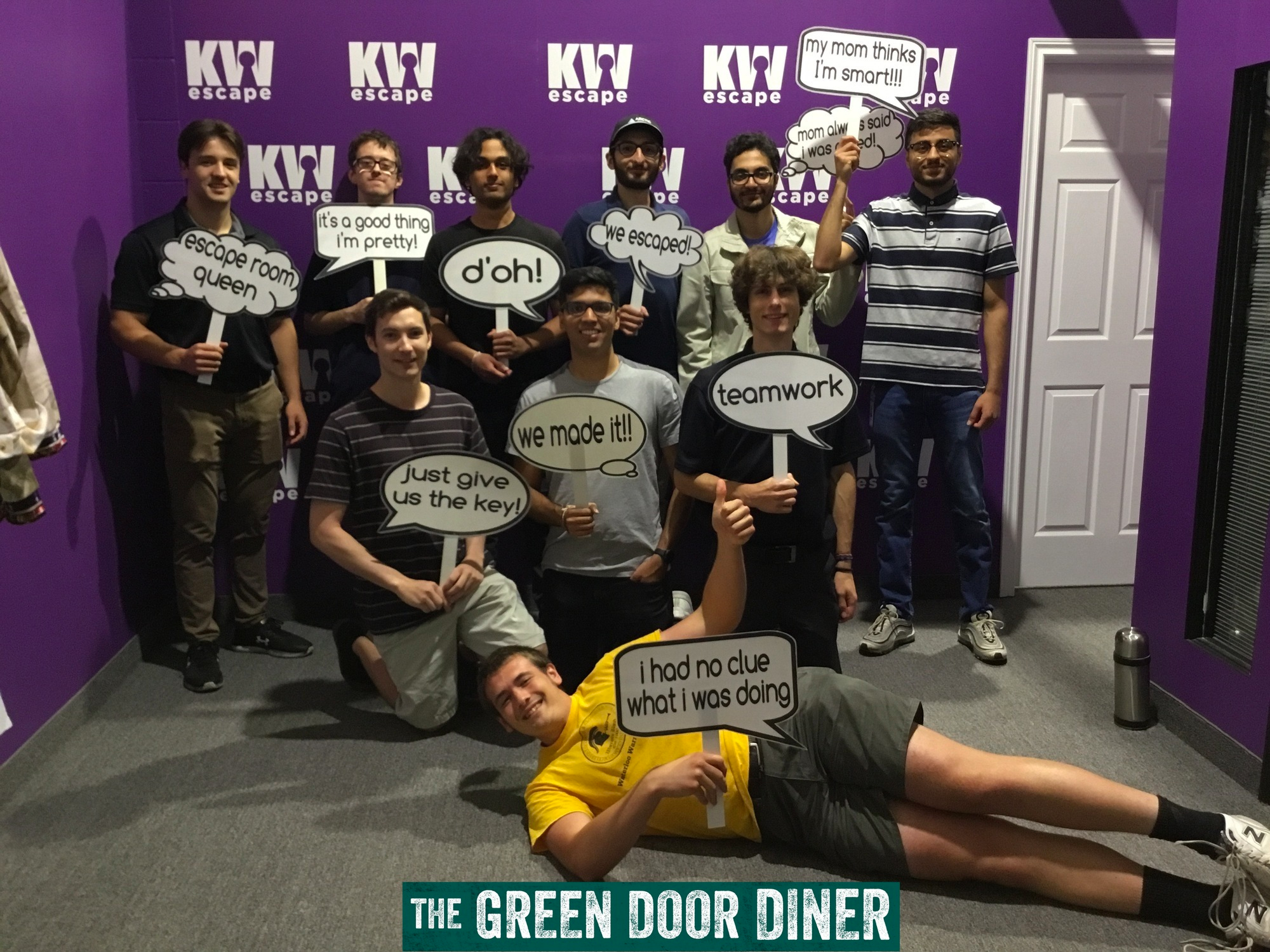Arctic Wolf co-op students posing for a group photo after completing an escape room during a work social event.