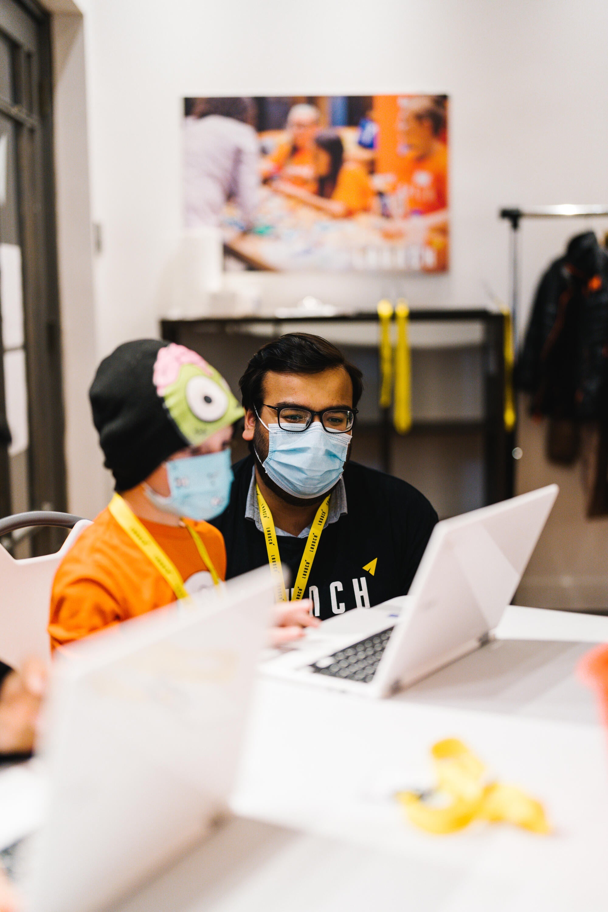 Ameen Yaseen working with a young student during his work term at LAUNCH Waterloo