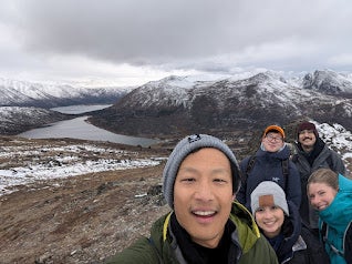 The Shoppers Drug Mart team in Whitehorse pose for a selfie with mountains in the backdrop