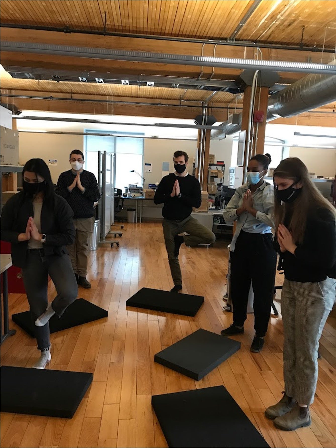 CleanSlate UV team members practicing yoga