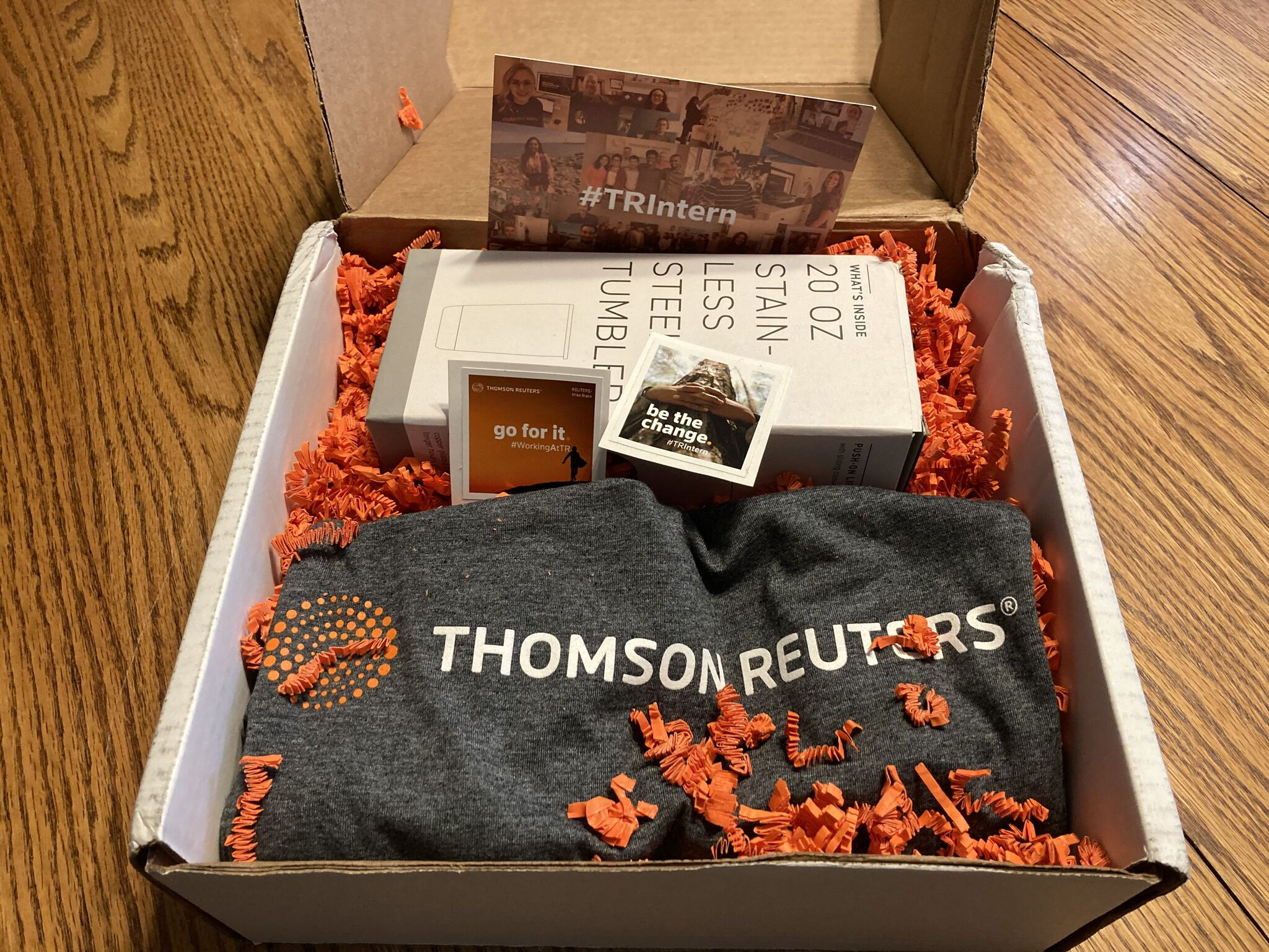 Box of branded swag for interns from Thomson Reuters 