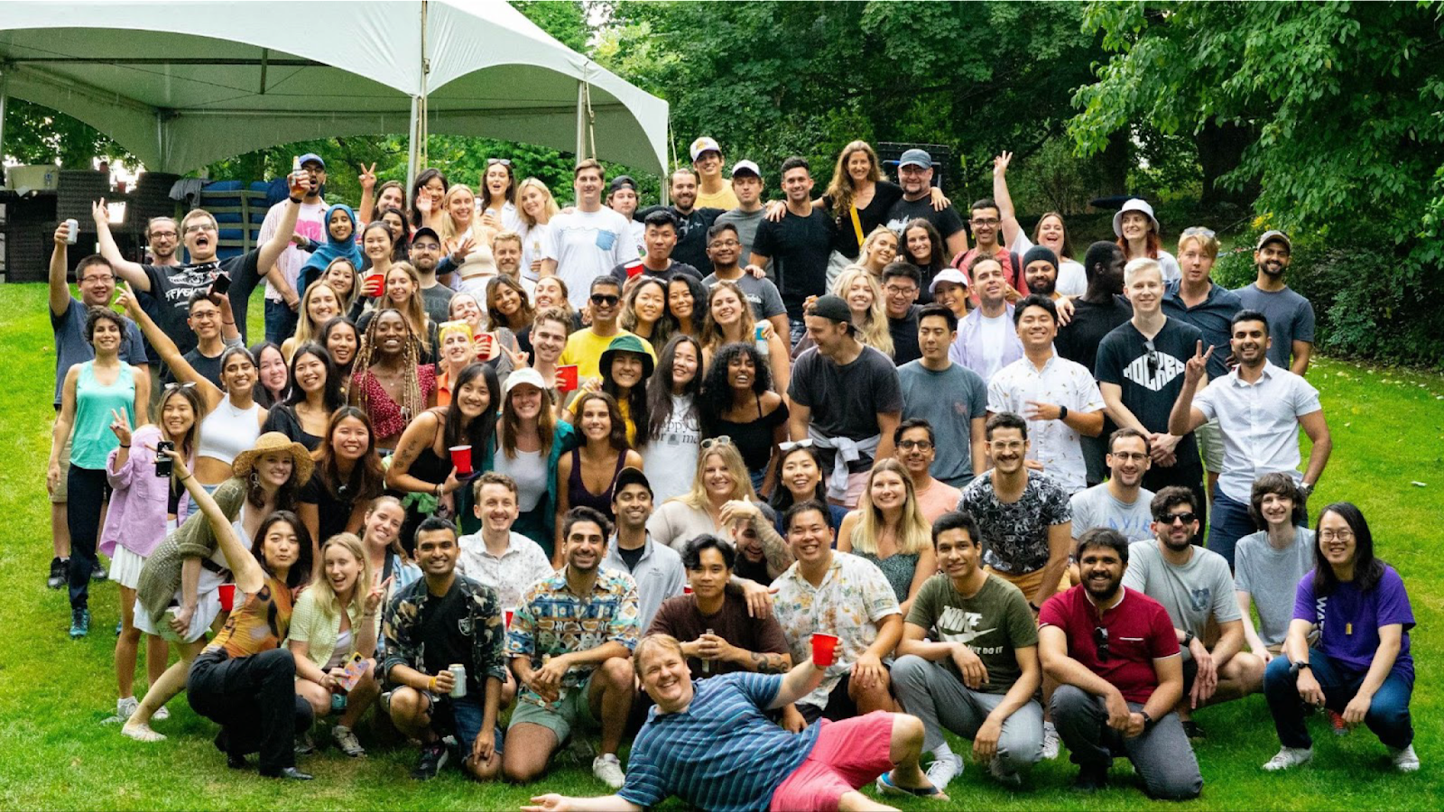 Large group shot of Perpetua employees and co-op students outside at a summer event