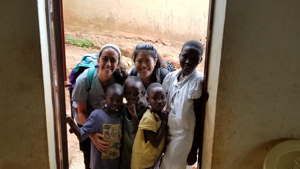 FullSoul co-op students smiling with children from Uganda