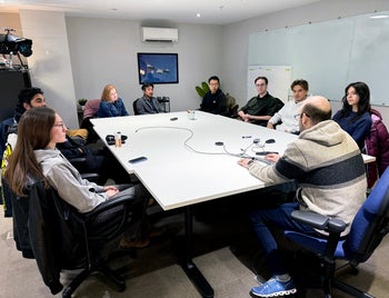 Group of students sitting in the Avidrone board room
