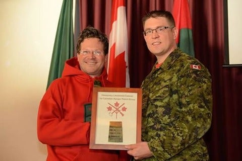 Prof. Lackenbauer receives his honorary appointment from Major Craig Volstad. 
