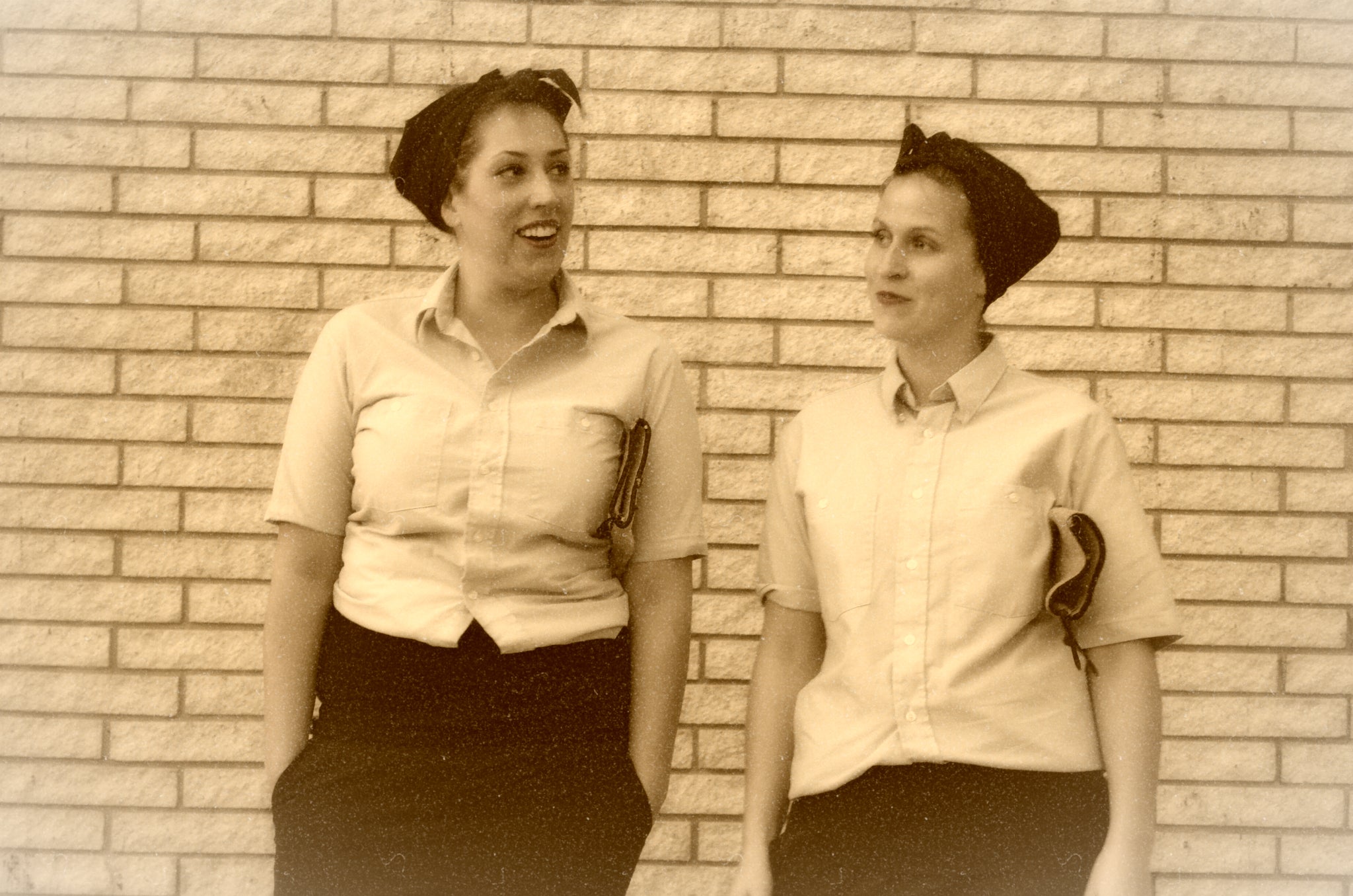 Two girls posing at 1940s workers