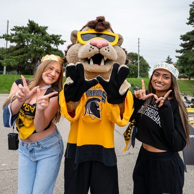 students with waterloo mascot, king warrior
