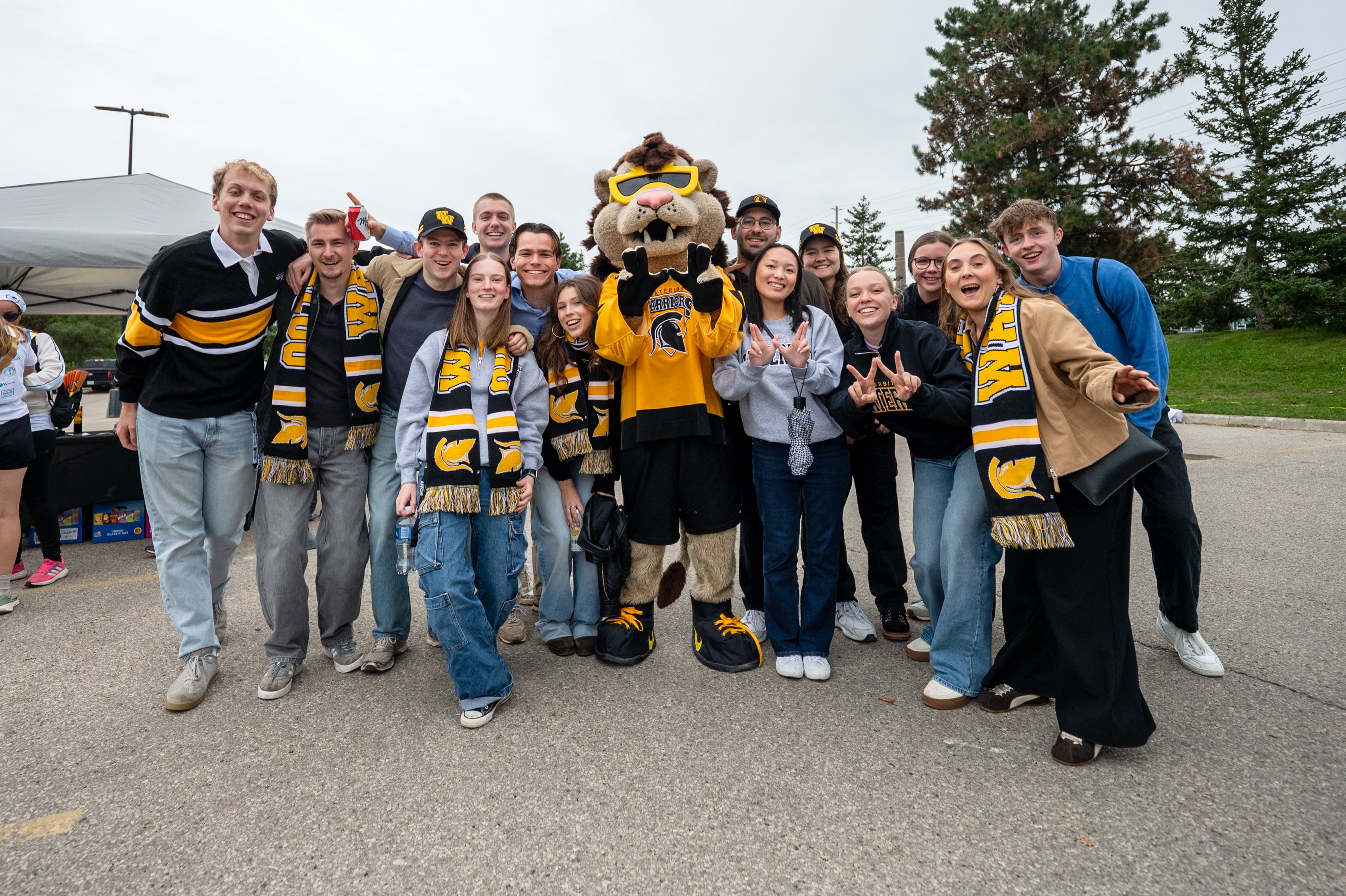 group of students with waterloo mascot, king warrior