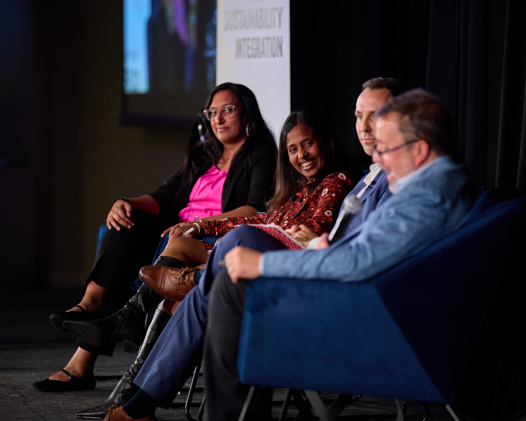 "Navigating the Crossroads" panel of speakers on stage at the Hub Conference