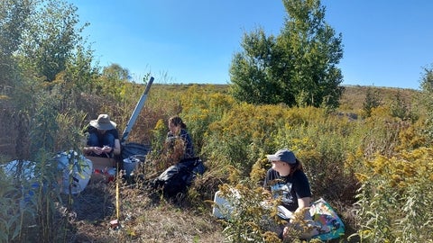 Hug lab conducting field work at a landfill