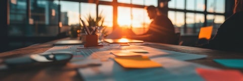 Office space at sunset with papers on a desk