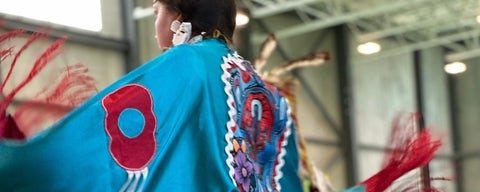 A dancer in Indigenous Regalia at the 2023 Pow Wow