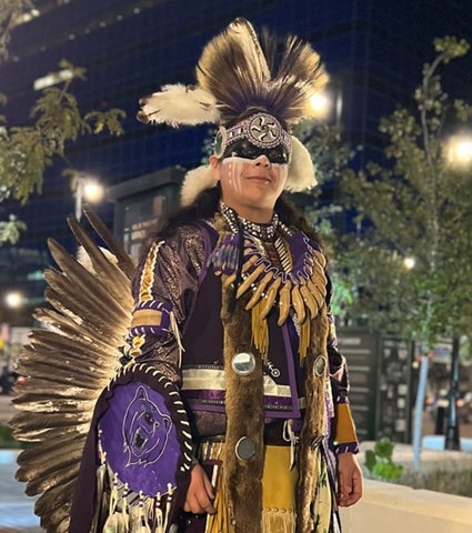 dancer in purple regalia