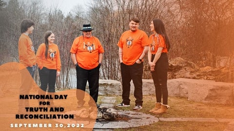 Indigenous people wearing orange shirts
