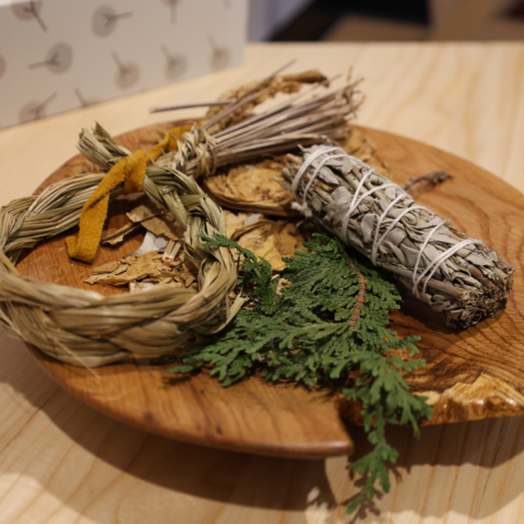 Sacred medicines displayed on a piece of wood