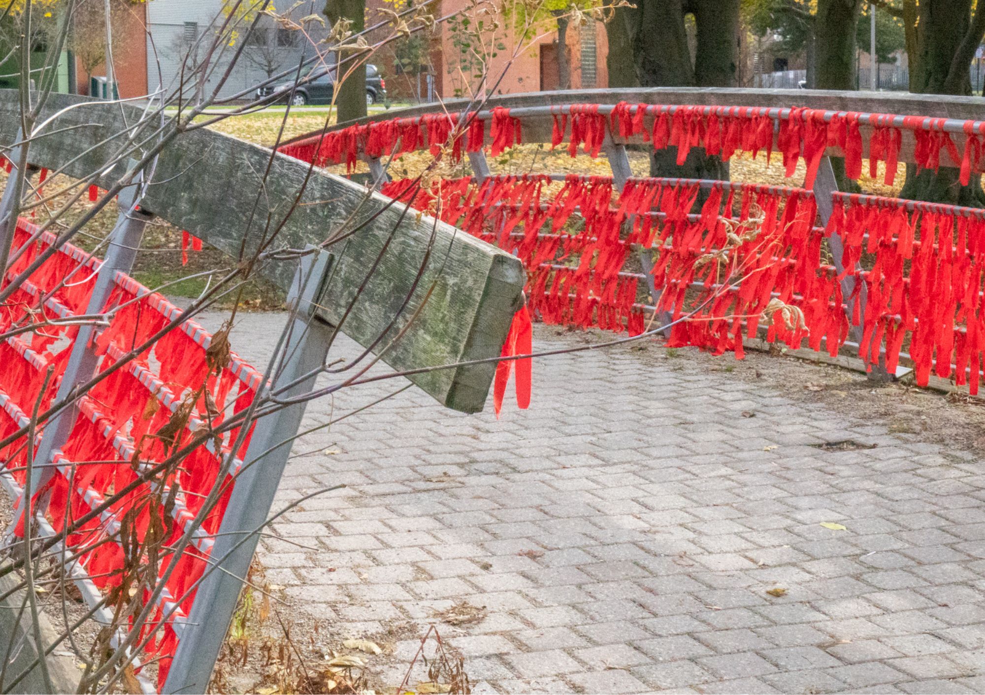 Red ribbons tied on a bridge
