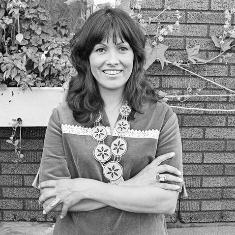 black and white image of lady crossing her arms