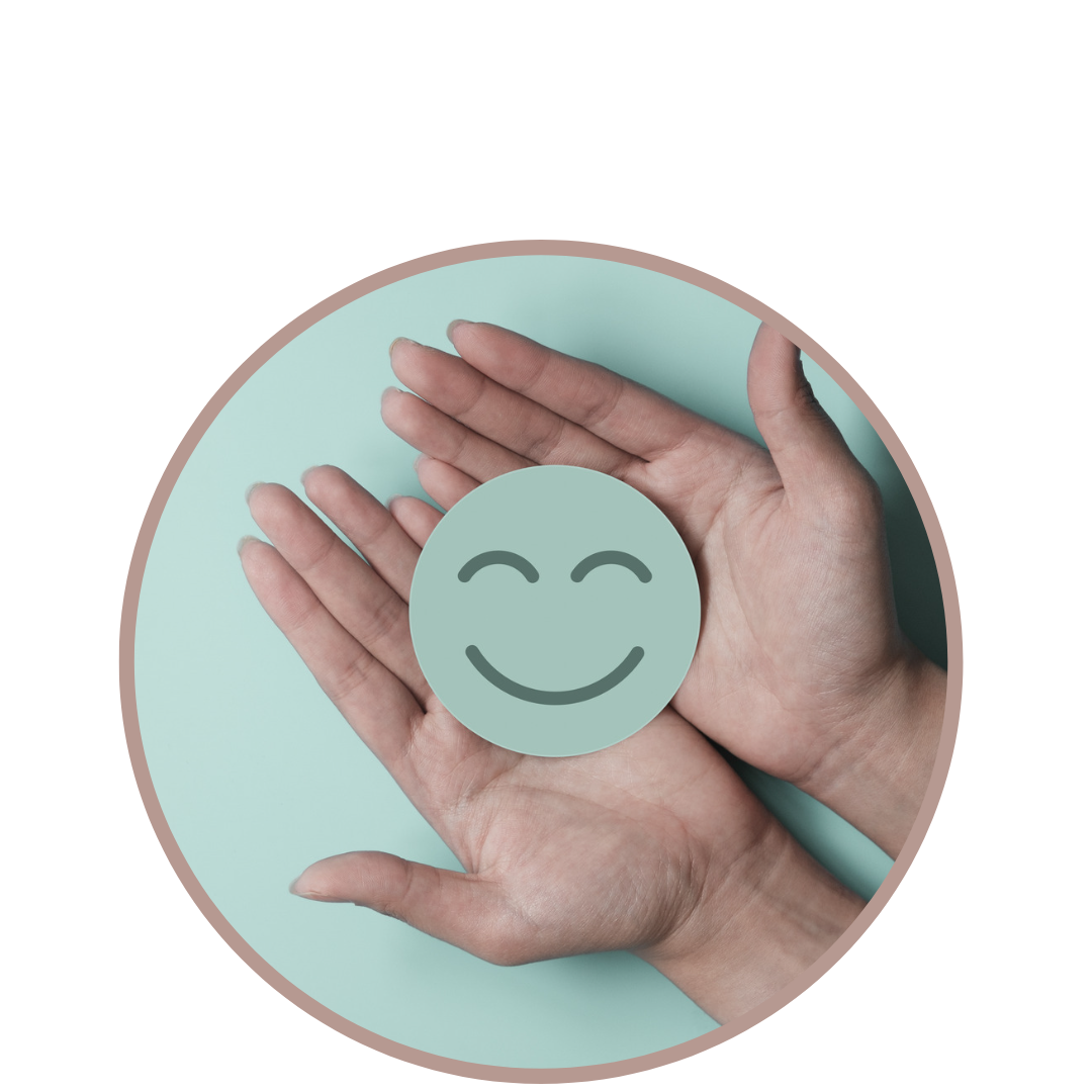 image of two hands holding a happy face cutout 