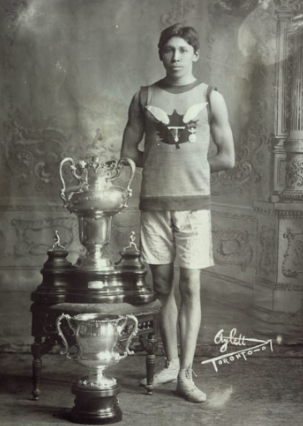 person standing beside trophy