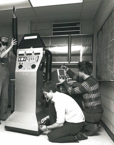Students working on computer, historical