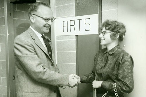 Arts student shaking professor's hand
