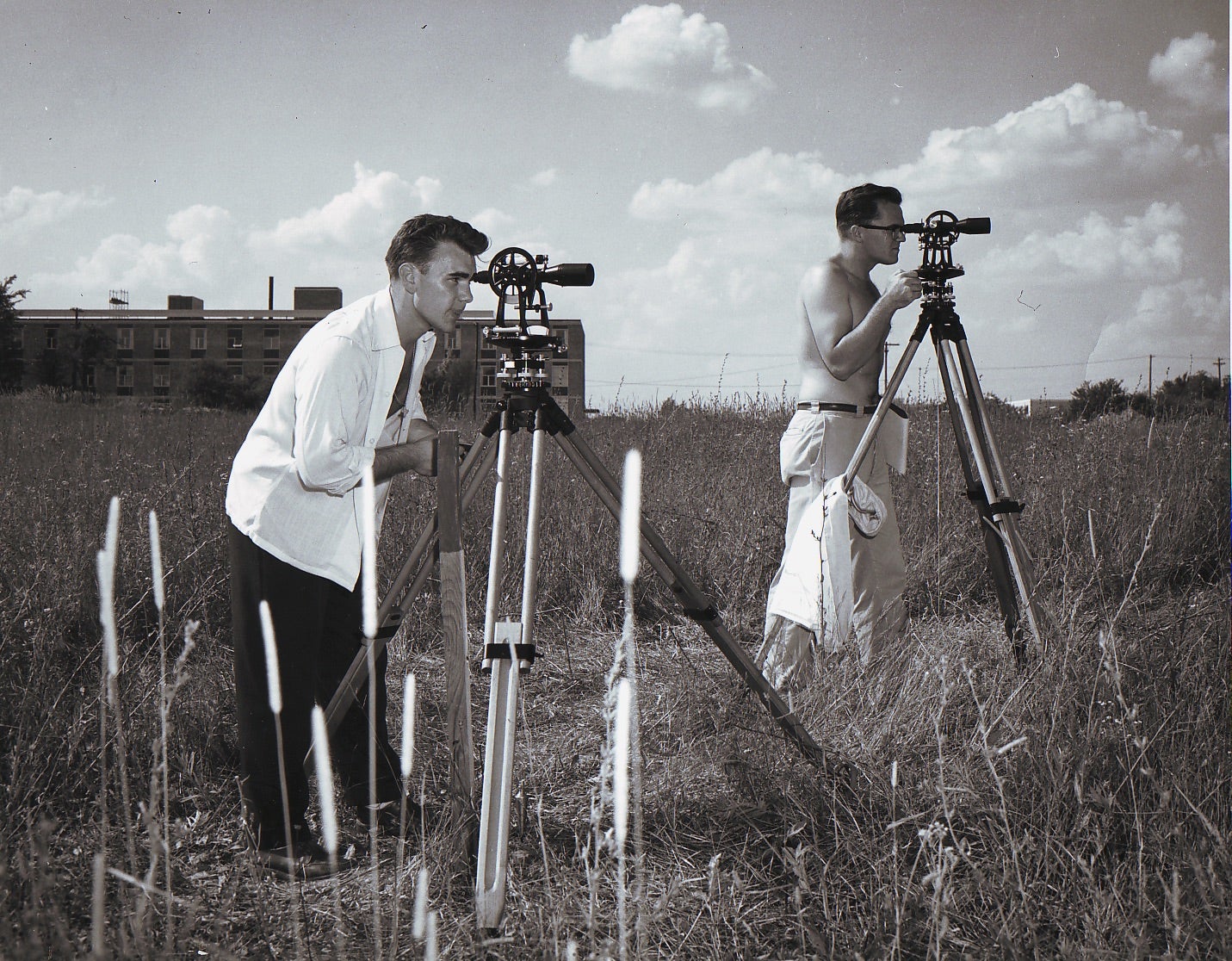 Engineers using sextant's to survey land.  