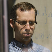 IQC Principal investigator, David Gosset performing quantum calculations on a window