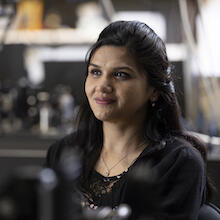 Nigar Sultana sitting in the Quantum Encryption and Science Satellite lab