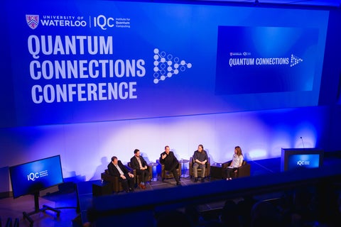 Five people on the Quantum Connections stage for a panel discussion