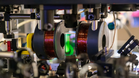 a quantum lab tool with green glowing light in the centre