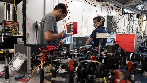 Two scientists working in quantum technology lab