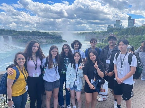 Students posing for a group photo at Niagara Falls