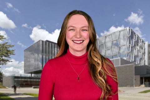 Angéline Lafleur standing in front of IQC's building