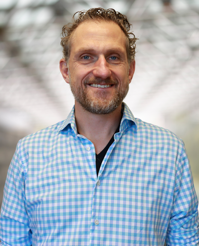 Michael Reimer standing in a sunlit room