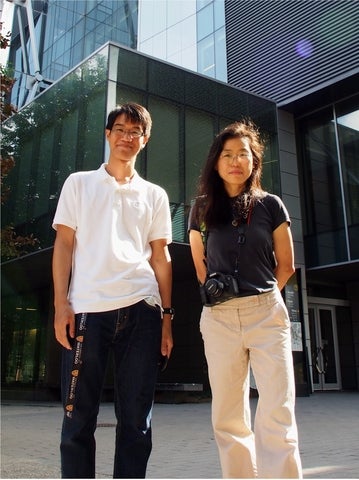 Theerapat Tansuwannont and Debbie Leung standing in front of the Mike & Ophelia Lazaridis Quantum Nano Centre