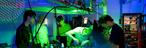 IQC Graduates students in a quantum optics lab