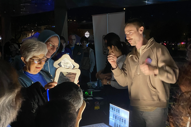 A man speaking to a group of people 