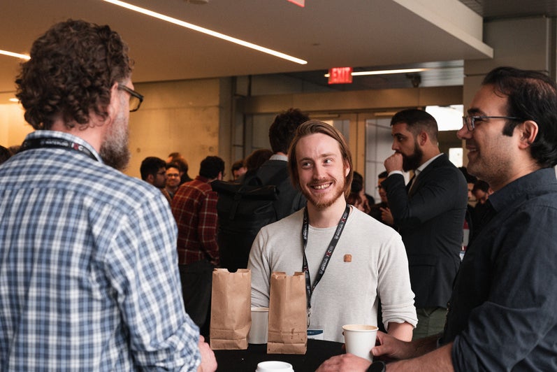 Guests conversing  at the Quantum Connections conference