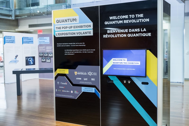 A collection of panels from QUANTUM: The Pop-Up Exhibition explain quantum information science and technology.