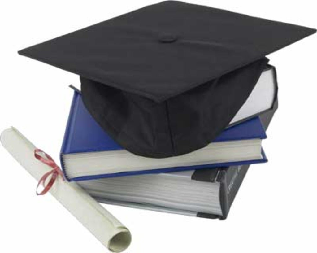 Ceremony cap and diploma on books