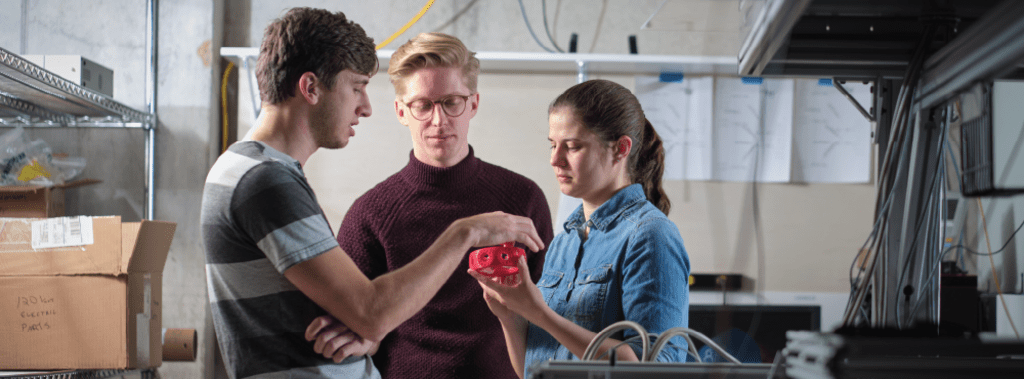 Crystal Senko and students in the Trapped Ion Lab
