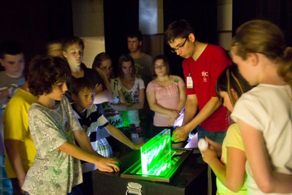 Students watching an act at the Cirque du Science